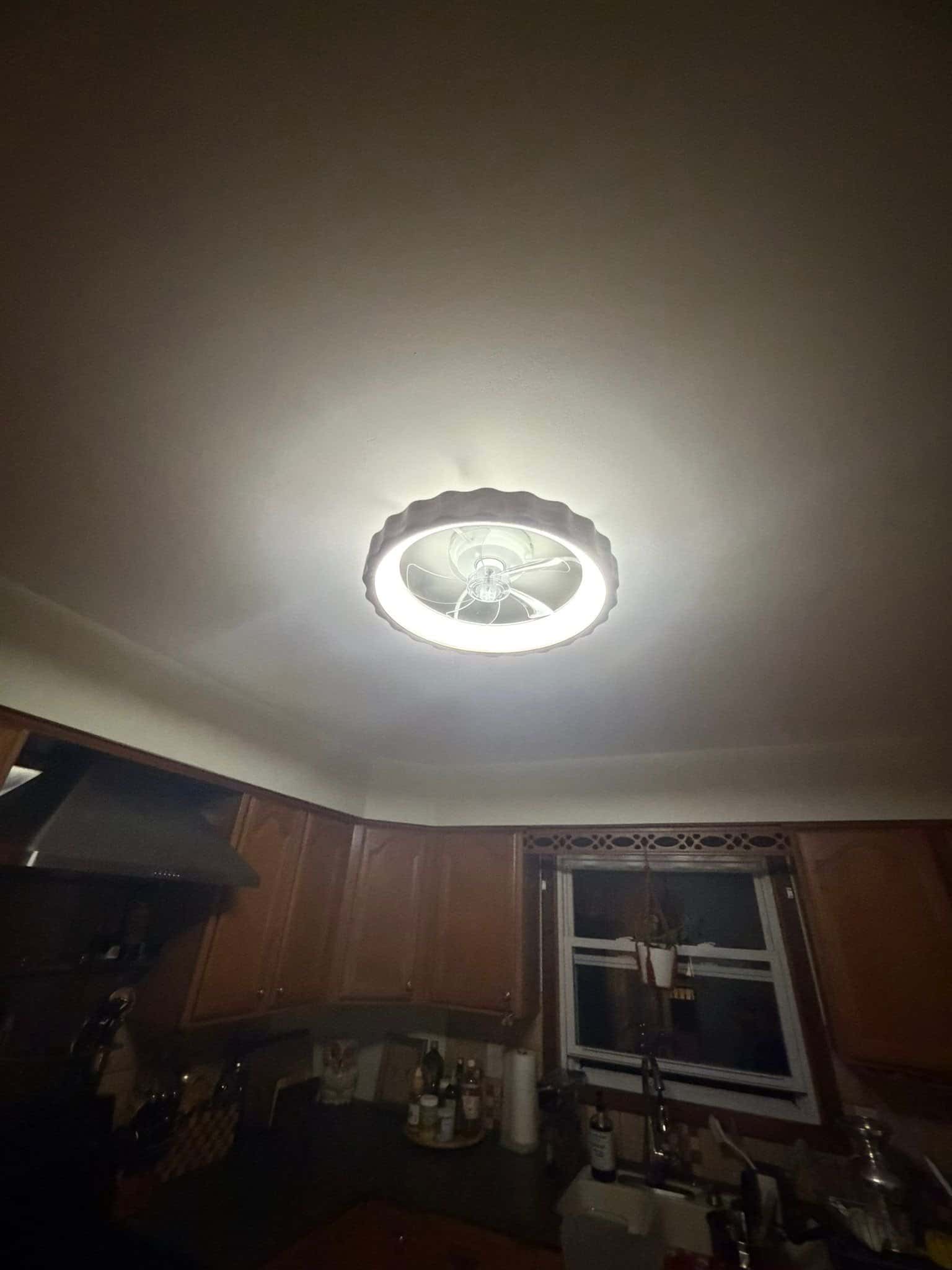 New round ceiling light glowing in a kitchen, customer's photo